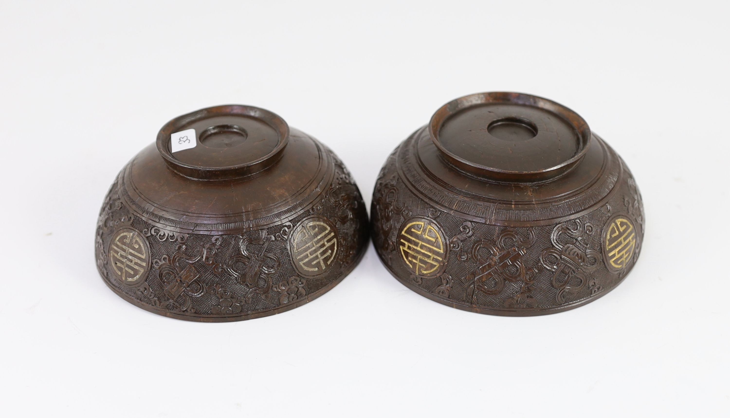 A pair of Chinese coconut bowls, 19th century, Approximately 12 cm diameter